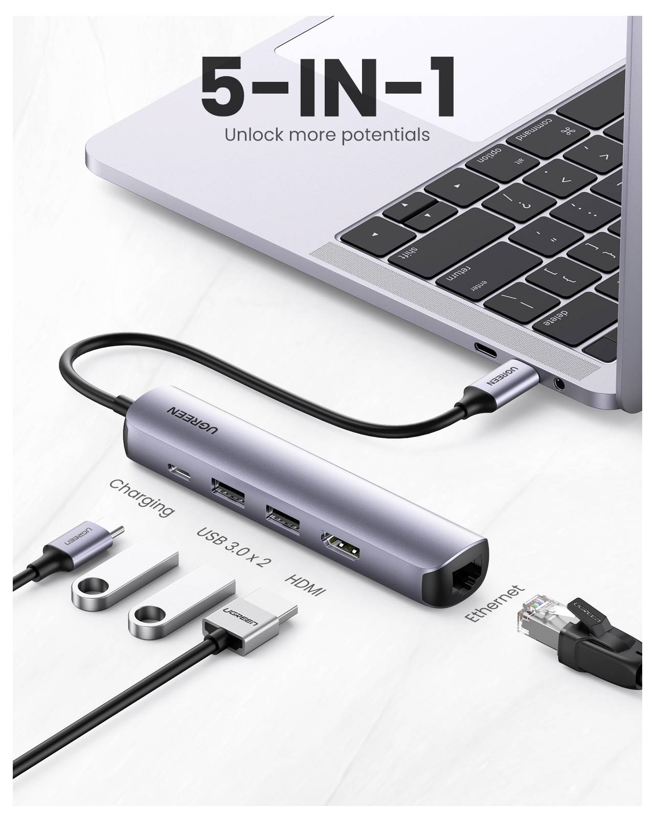 Laptop je připojen k 5-v-1 USB-C rozbočovači zobrazující porty pro nabíjení, dva USB 3.0, HDMI a Ethernet. Text říká 'Odemkněte další potenciály'.