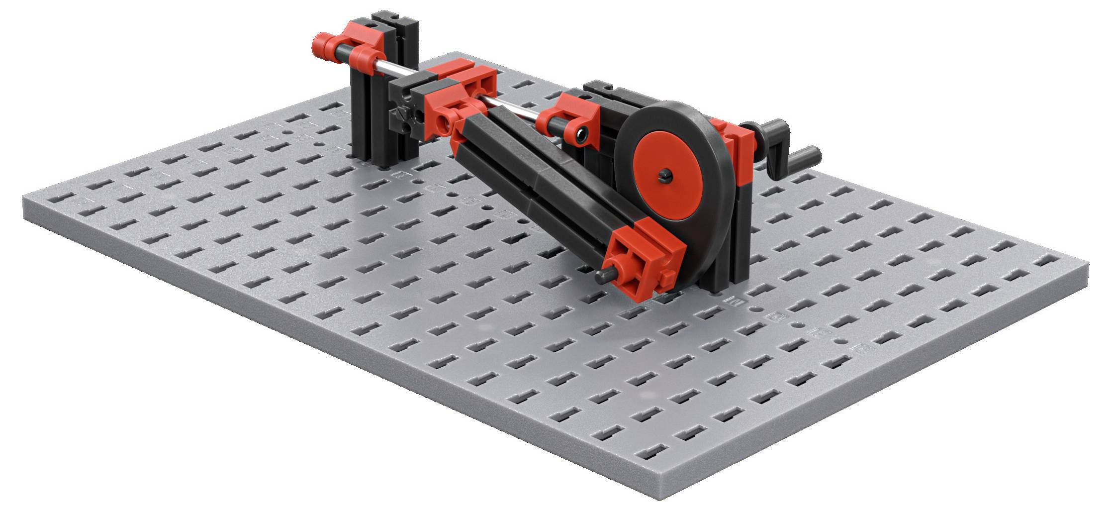 Lego konstrukce na perforované základně, zobrazující černo-červerou mechanickou sestavu s ozubenými koly a pákami.