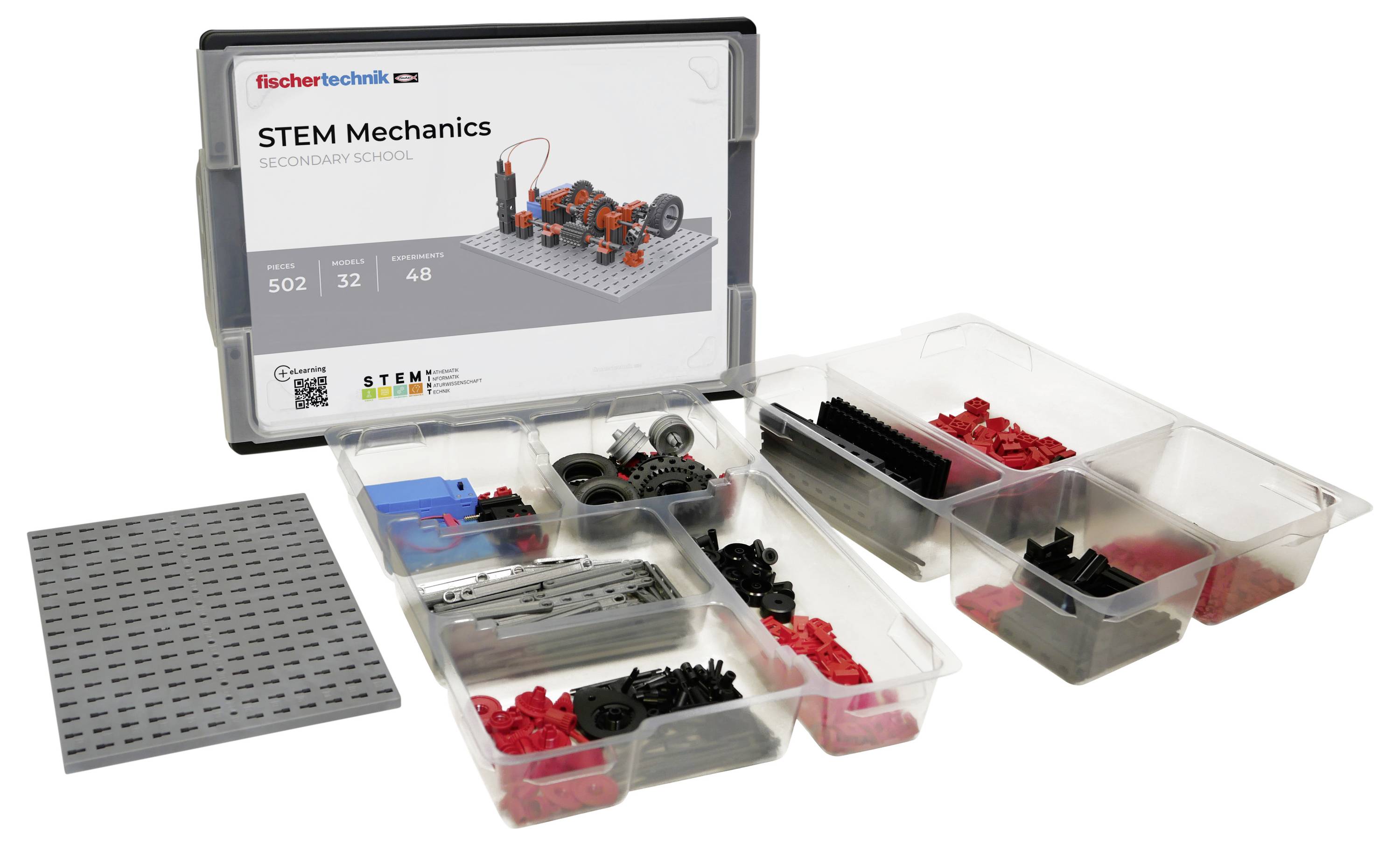 Sada mechaniky pro STEM pro střední školy s různými díly a základní deskou pro stavbu. Etiketa na krabici zobrazuje 'fischertechnik'.