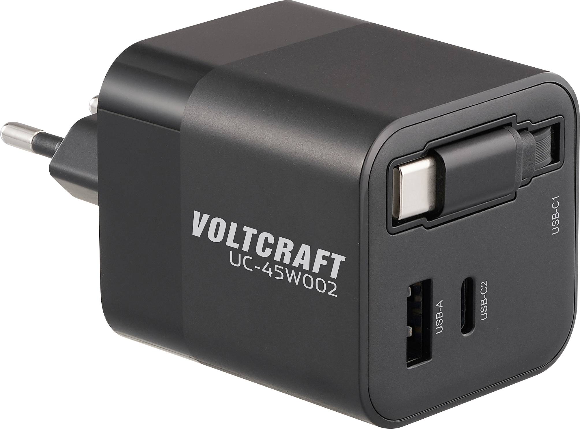 Je zobrazen černý nabíječ Voltcraft UC-45W002 s porty USB-A, USB-C1 a USB-C2, který je vhodný pro různá zařízení.