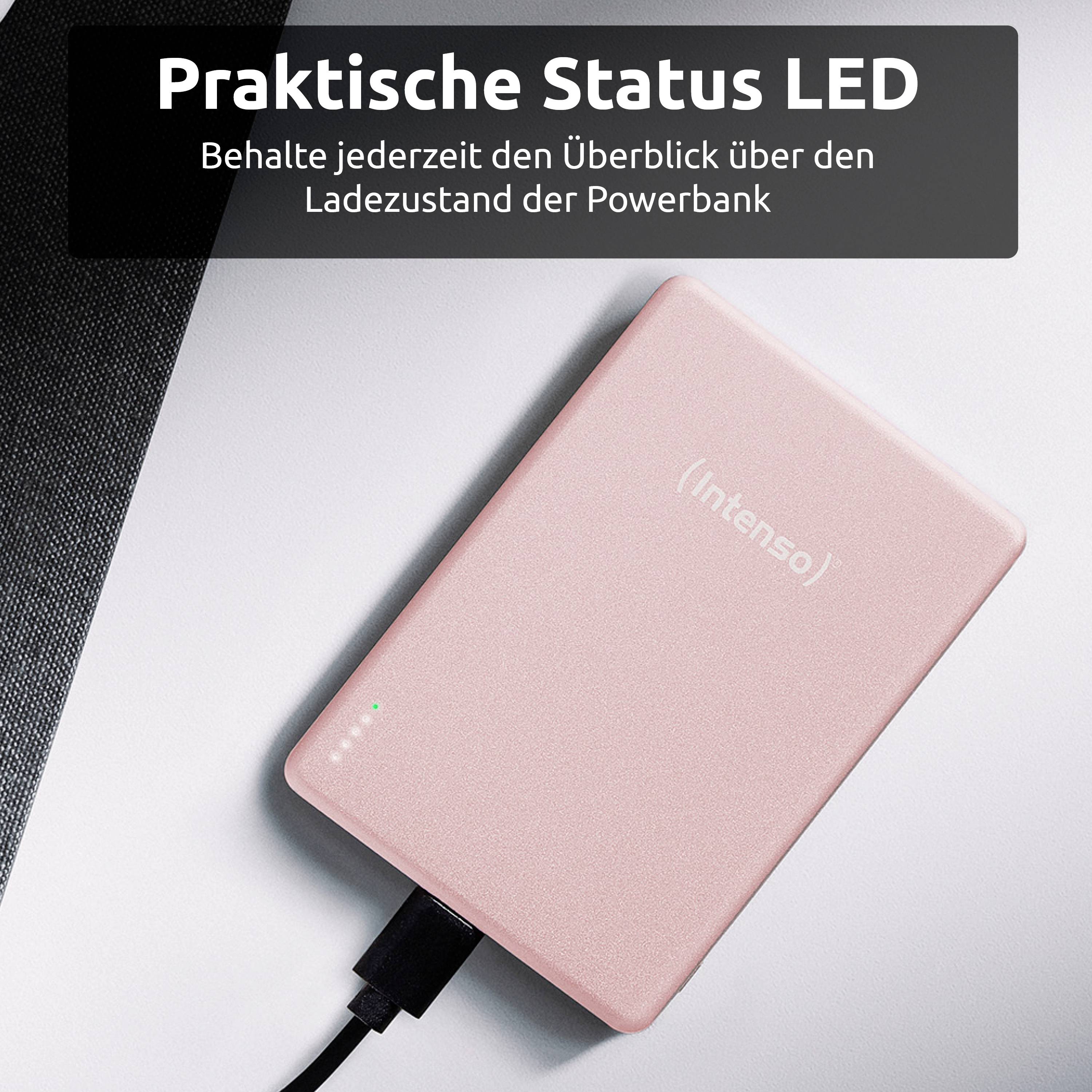 Růžová powerbanka s praktickým LED displejem pro zobrazení stavu a připojeným nabíjecím kabelem.