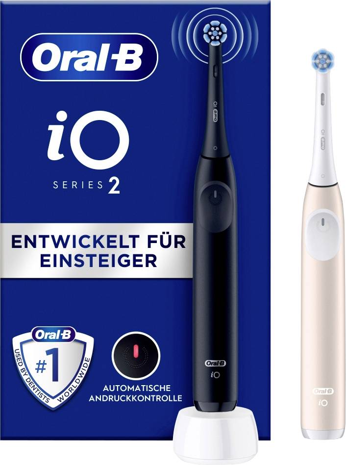 Balení s elektrickou zubní kartáčkem Oral-B iO Series 2, vyvinutým pro začátečníky. Dva modely zobrazeny: černý a růžovo-zlatý. S kontrolou přítlaku.