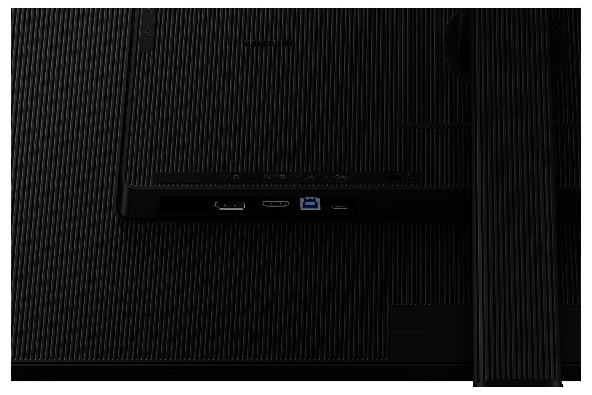 Detailní záběr zadního panelu monitoru zobrazující porty včetně HDMI, USB a napájecího vstupu. Povrch má strukturovaný povrch.