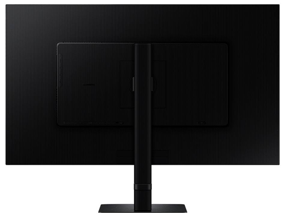 Pohled zezadu na černý počítačový monitor s obdélníkovým stojanem, zobrazující zadní panel obrazovky a její podpůrnou strukturu.