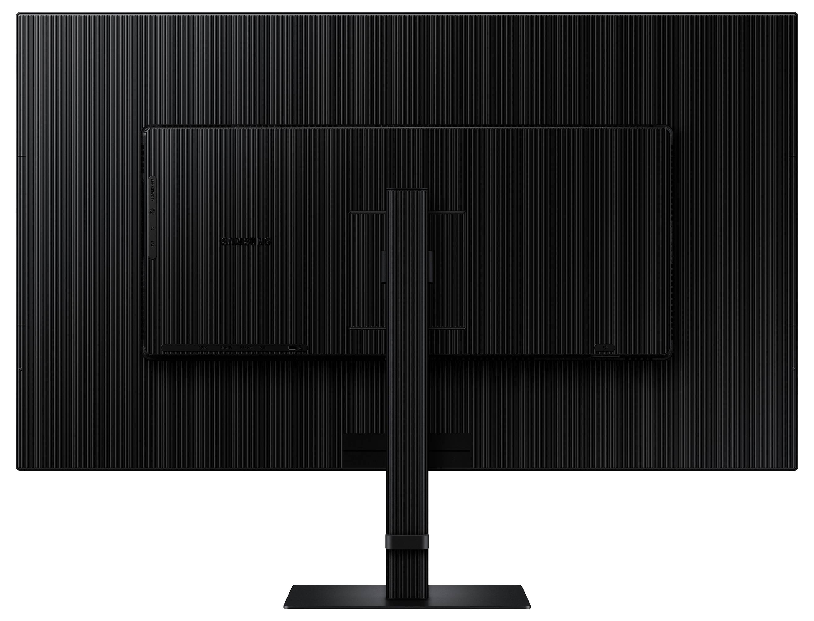 Černý širokoúhlý monitor se stojanem, pohled zezadu, na jednoduchém pozadí.