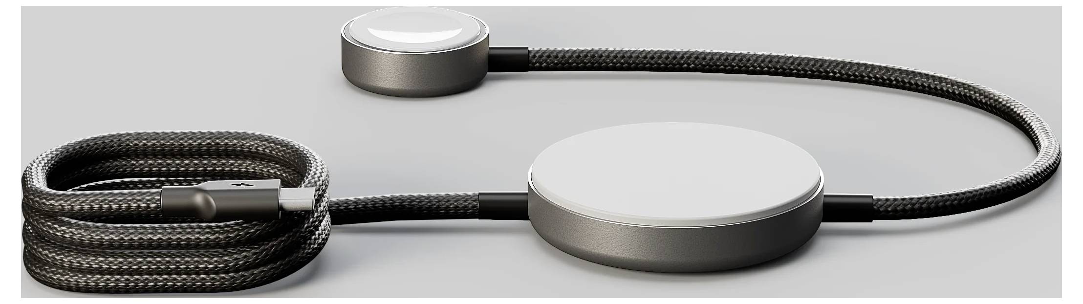 Černý tkaný nabíjecí kabel se dvěma kruhovými magnetickými podložkami, jednou větší a jednou menší, určený pro nabíjení kompatibilních zařízení.