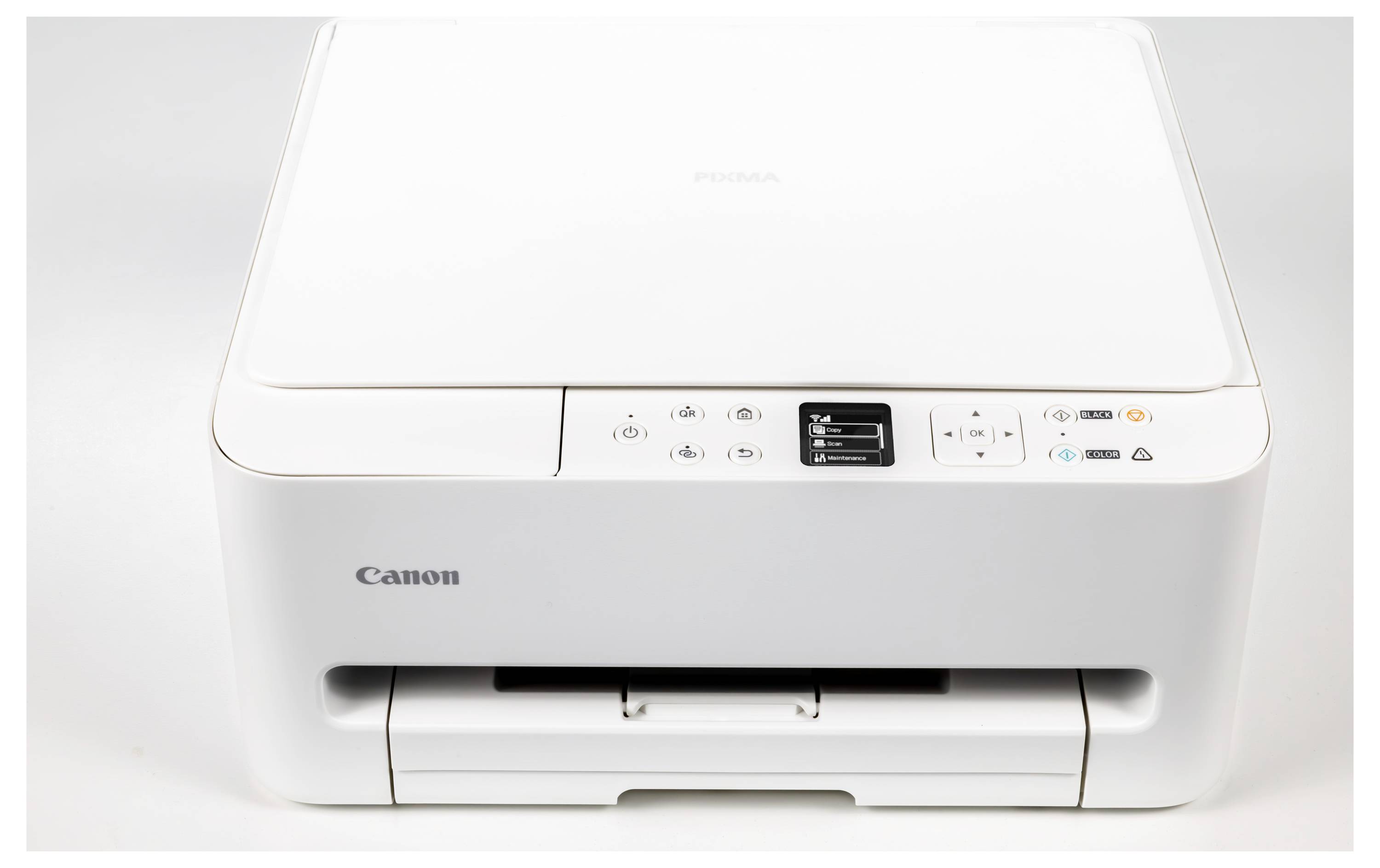 Bílá tiskárna Canon s ovládacími tlačítky a displejem nahoře, vykazující elegantní design vhodný pro domácí nebo kancelářské využití.