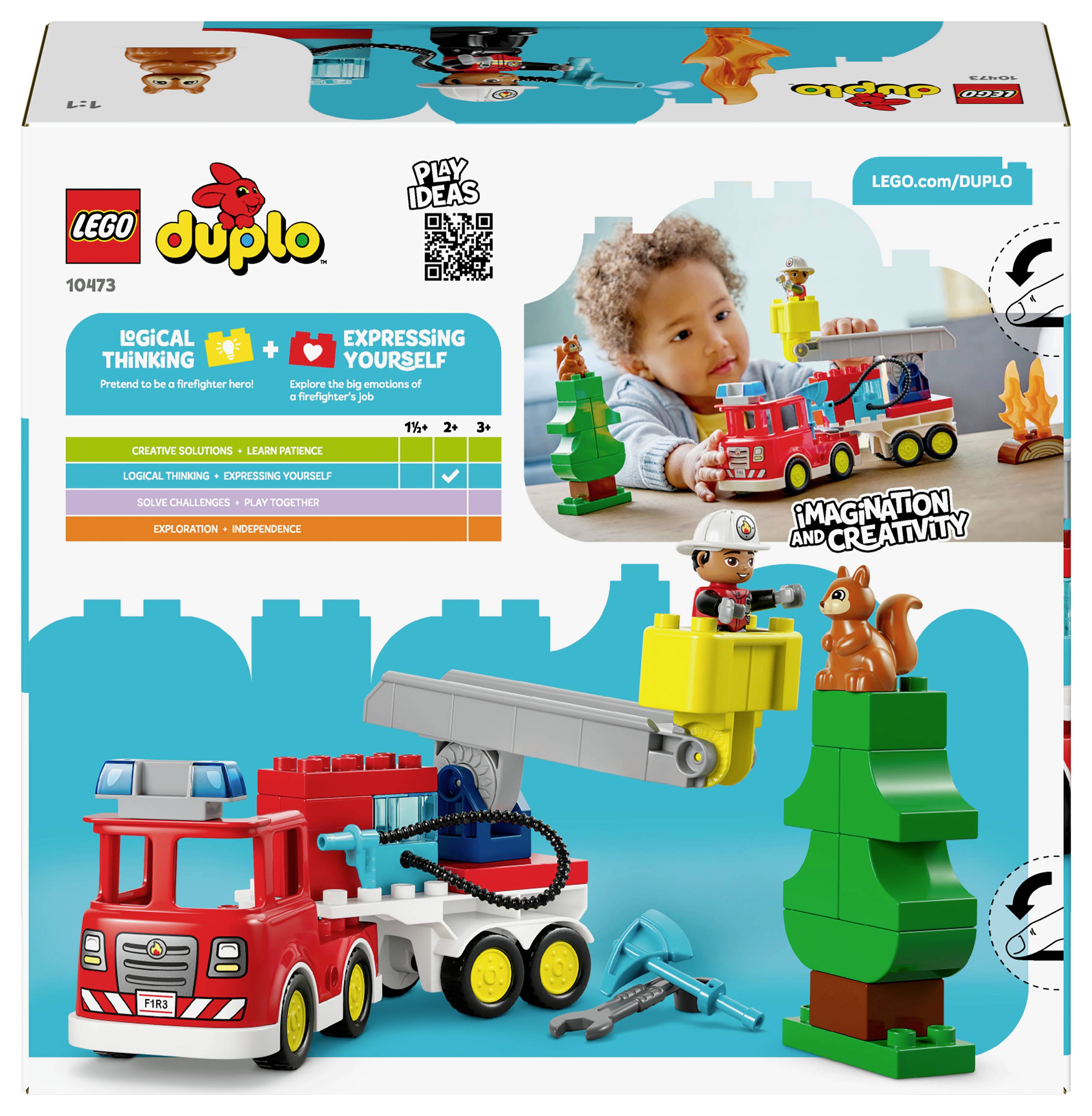 Obal sady Lego DUPLO 10473. Obsahuje dítě si hrající, hračku hasičského vozu s žebříkem, figurku hasiče a komponenty lesní scény.