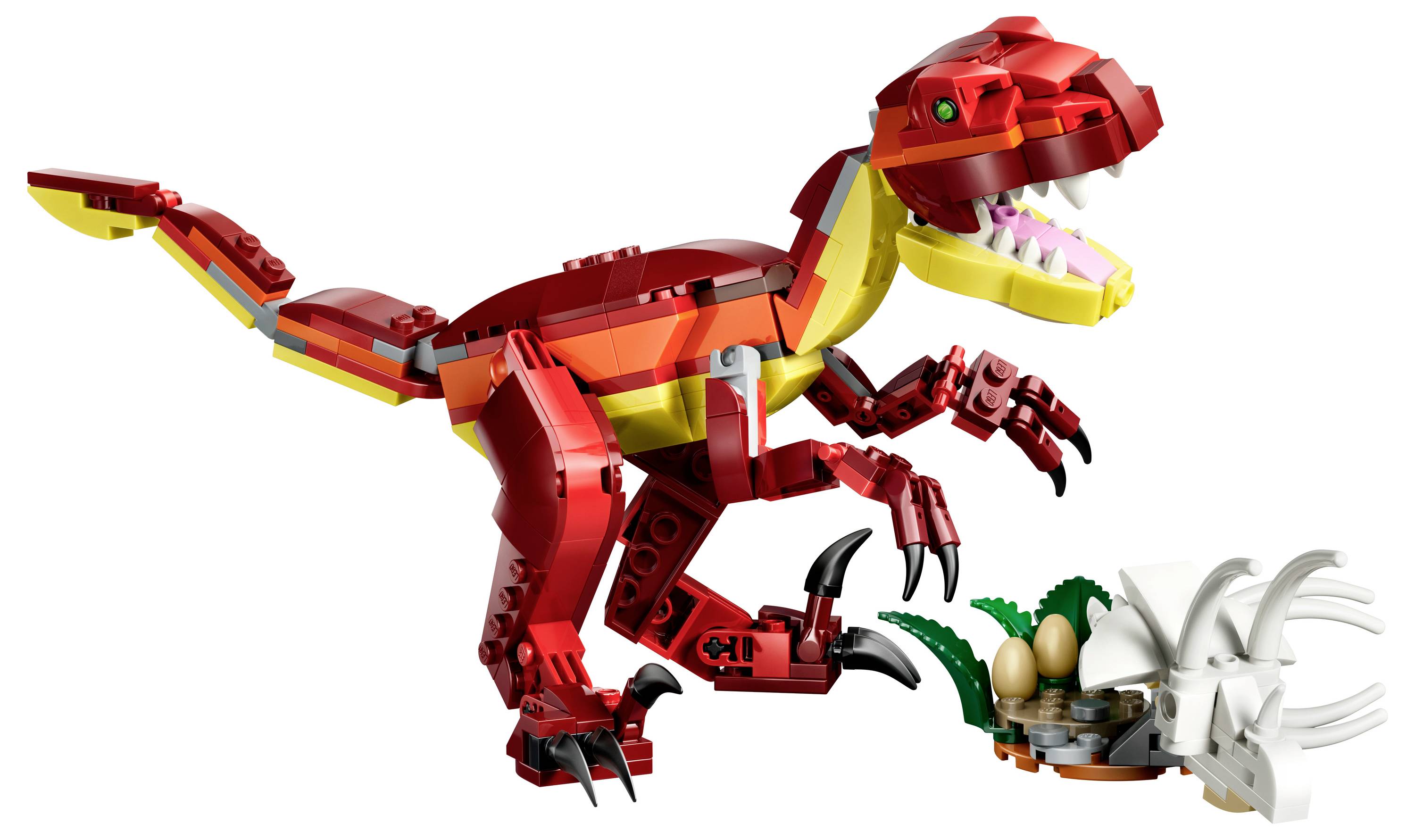 Červený a žlutý hračkářský dinosaurus s otevřenou tlamou stojí na dvou nohách poblíž malého bílého hnízda s modelem vajec.