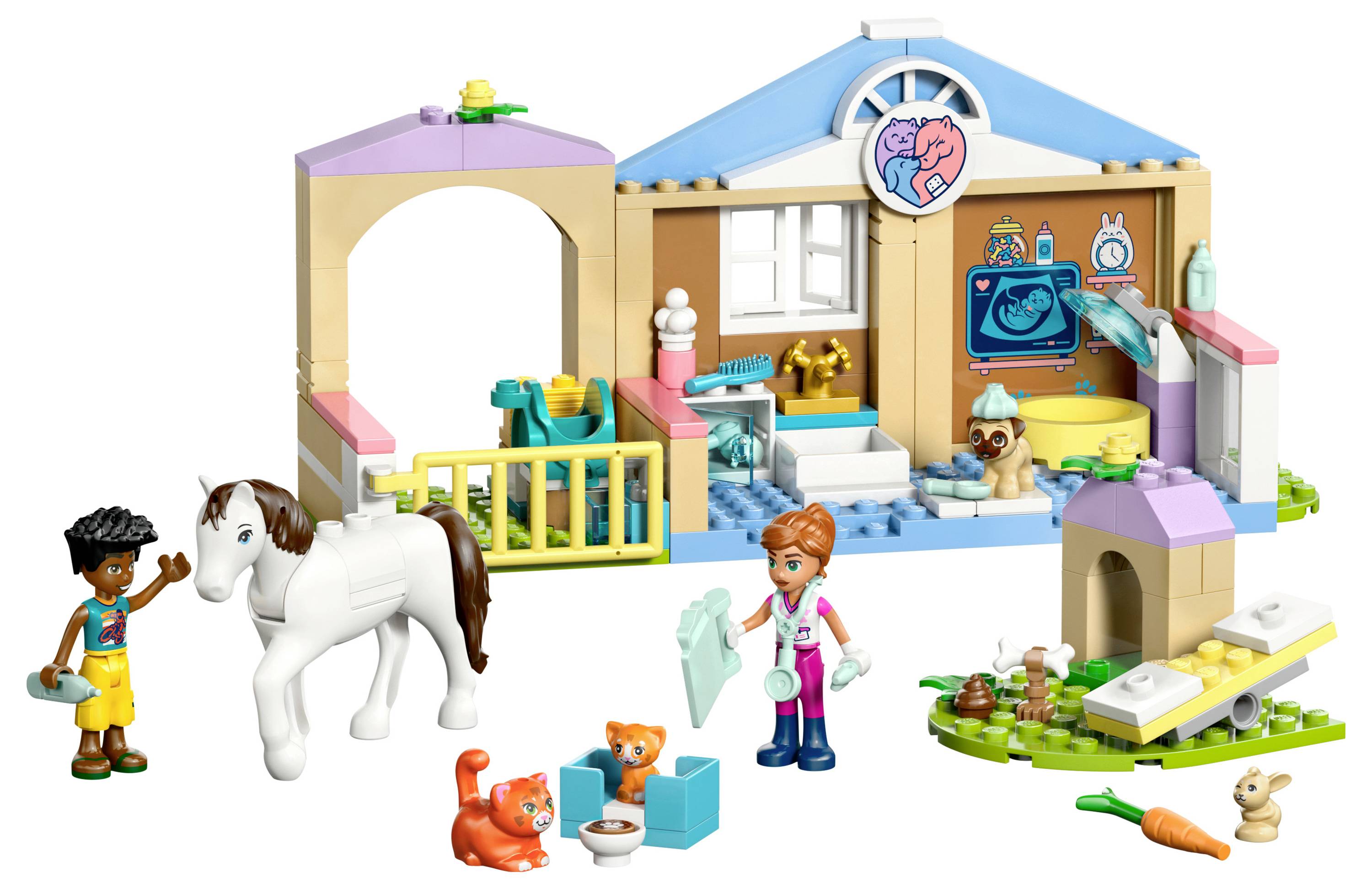 Sada LEGO veterinární ordinace s koněm, dvěma koťaty, králíkem, veterinářem držícím ručník a dítětem s kartáčem, včetně doplňků.