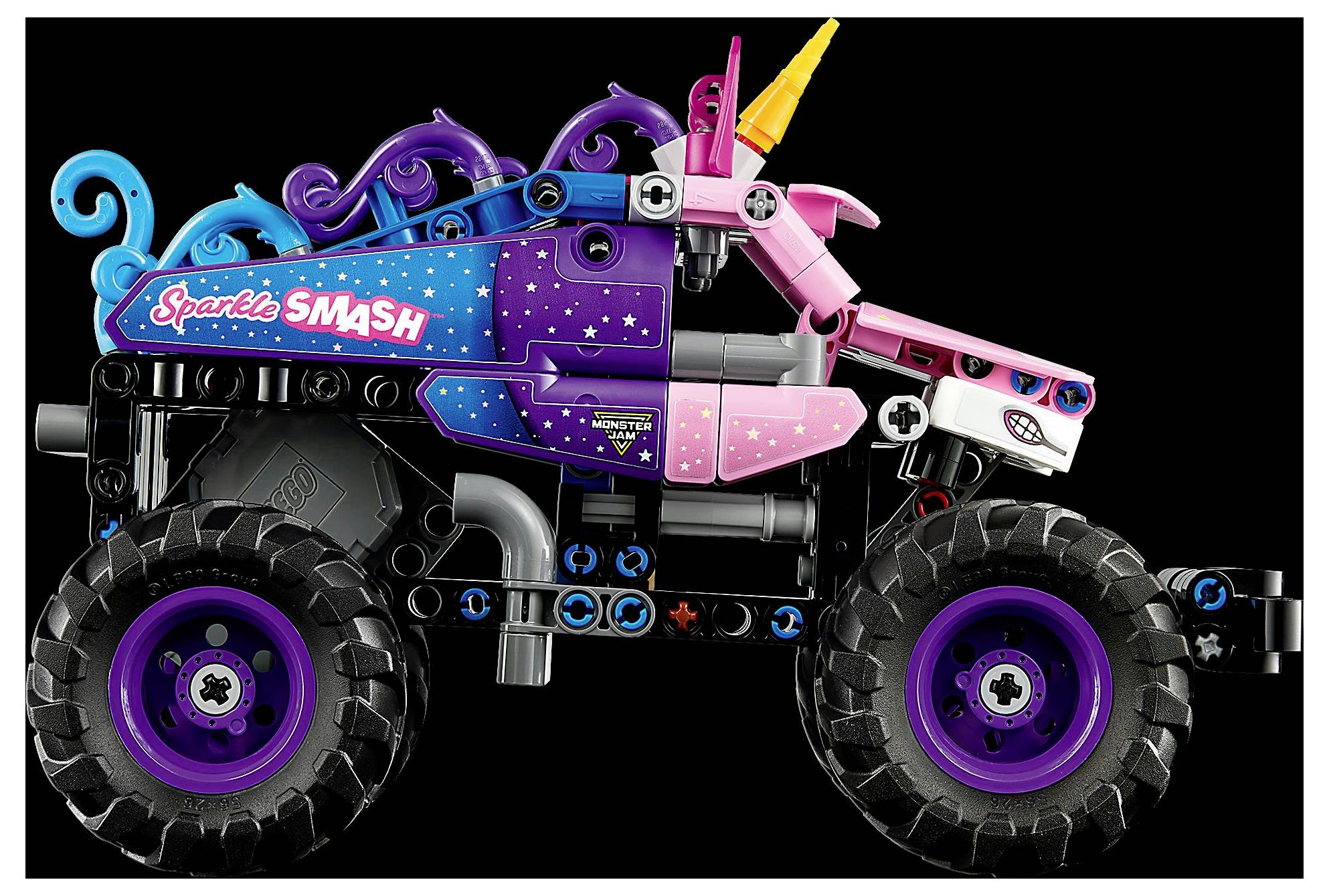 Barevný hračkářský monster truck s velkými pneumatikami, růžovo-modým designem, s motivem jednorožce, včetně rohu a nápisem "Sparkle SMASH".