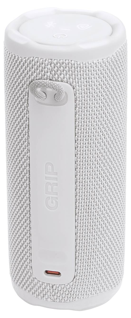 Přenosný bílý bluetooth reproduktor s válcovým designem a texturovaným látkový povrchem, vybavený vypínačem a nabíjecím portem.