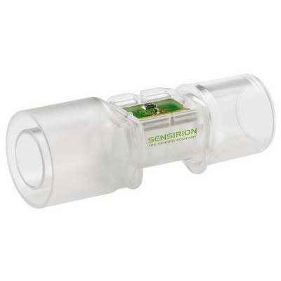 Průhledný lékařský průtokoměr s viditelnými vnitřními elektronickými součástkami, označený nápisem 'Sensirion The Sensor Company', určený pro měření průtoku vzduchu.