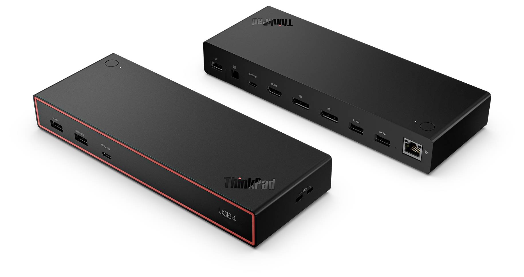 Obdélníková černá dokovací stanice s několika porty včetně HDMI, USB a Ethernetu, umístěná na bílém povrchu.