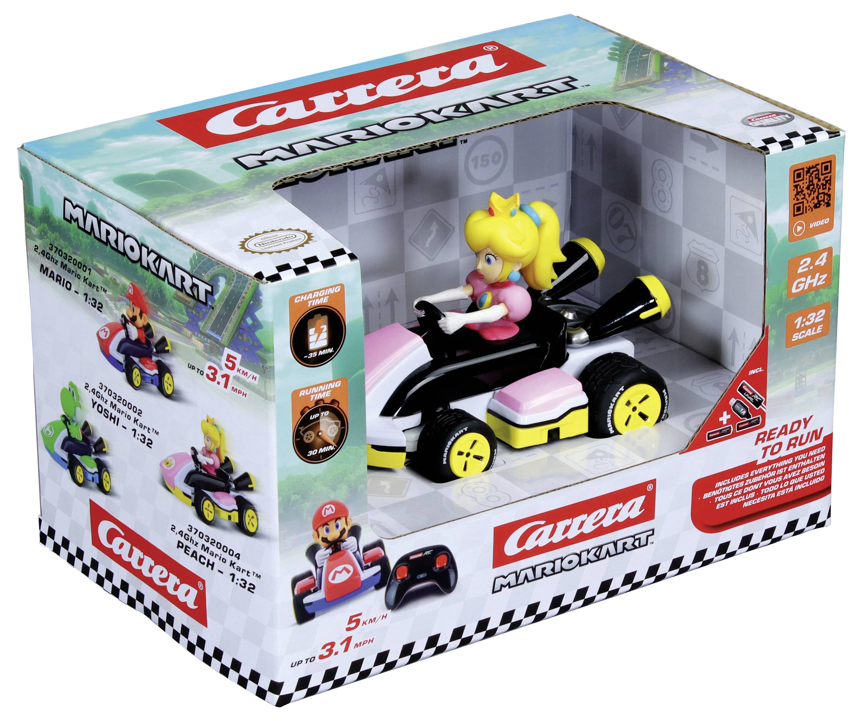 Sada hraček zobrazující princeznu Peach, která řídí růžovo-černé vozidlo z Mario Kart, vystavené v barevné krabici označené 'Carrera Mario Kart.'