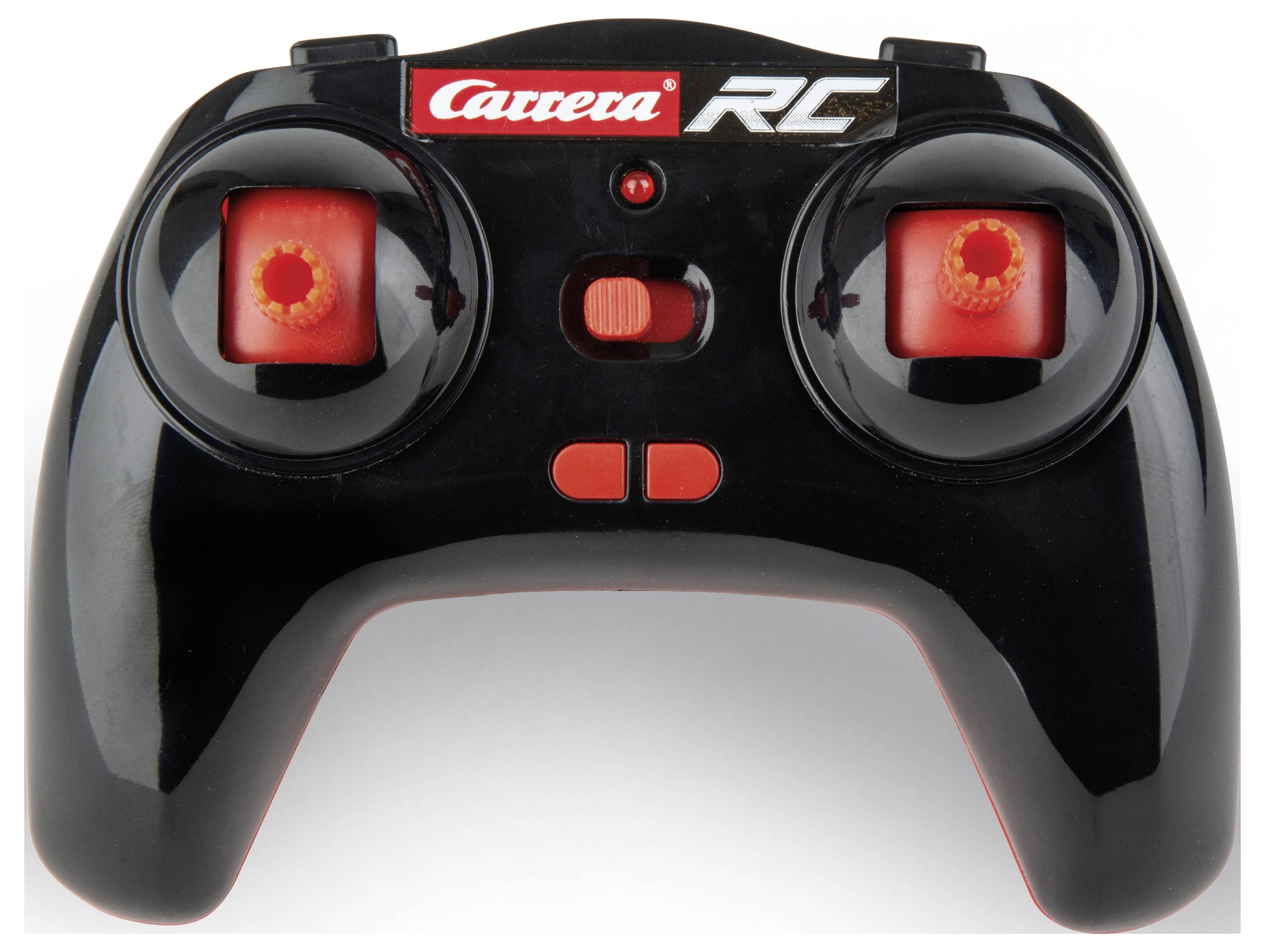 Dálkový ovladač 'Carrera RC' v černé a červené barvě se dvěma joysticky a tlačítky, určený k ovládání modelů na dálkové ovládání.