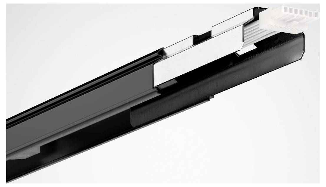 Mechanická pojezdová lišta v černé barvě se stříbrným rozšiřujícím kouskem, používaná pro pohyb zásuvky nebo dveří.