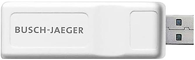 Bílé USB zařízení s nápisem „Busch-Jaeger" vytištěným na něm, což naznačuje, že se pravděpodobně jedná o značkový elektronický příslušenství nebo nástroj.