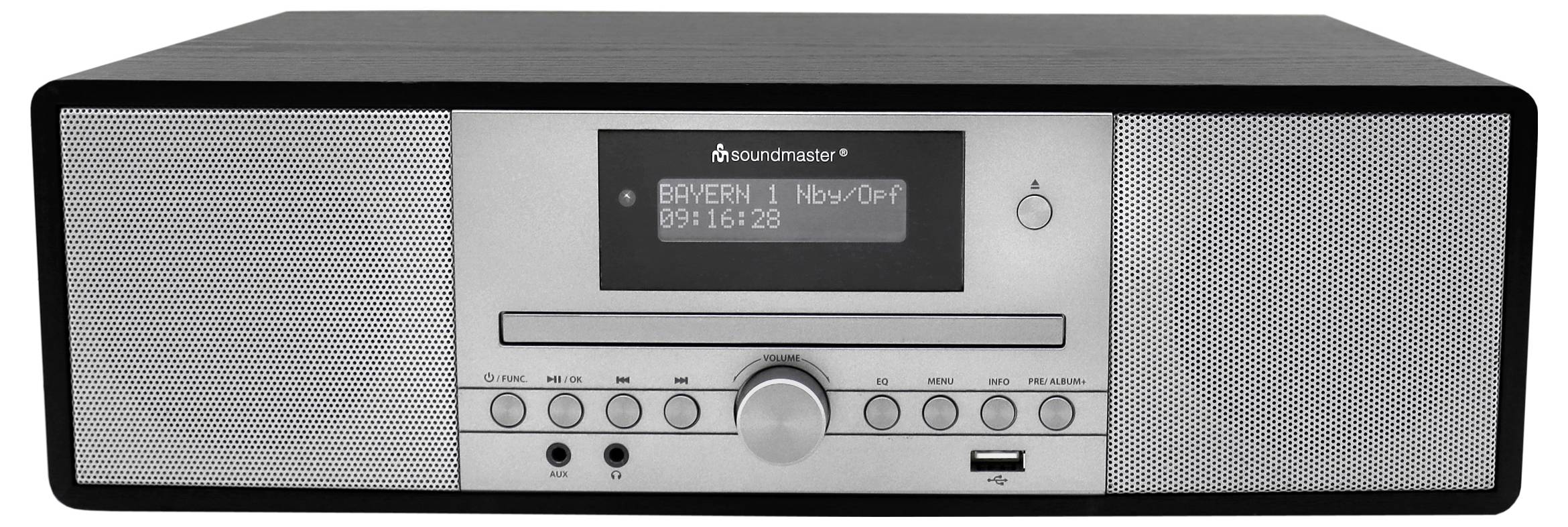 Stříbrno-černé stolní rádio s digitálním displejem zobrazujícím 'Bayern 1 Nov/01 09:16:39'. Má tlačítka, ovladač hlasitosti a reproduktory.