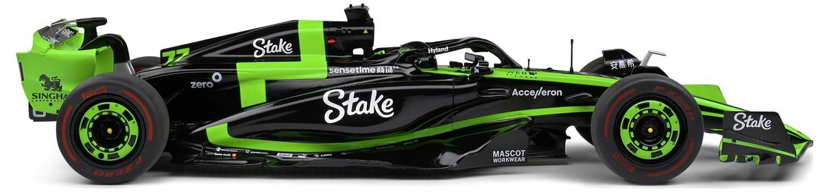 Zeleno-černý vůz Formule 1 se slovem 'Stake' výrazně zobrazeným na jeho karoserii, který vykazuje aerodynamický design a sponzorské loga.