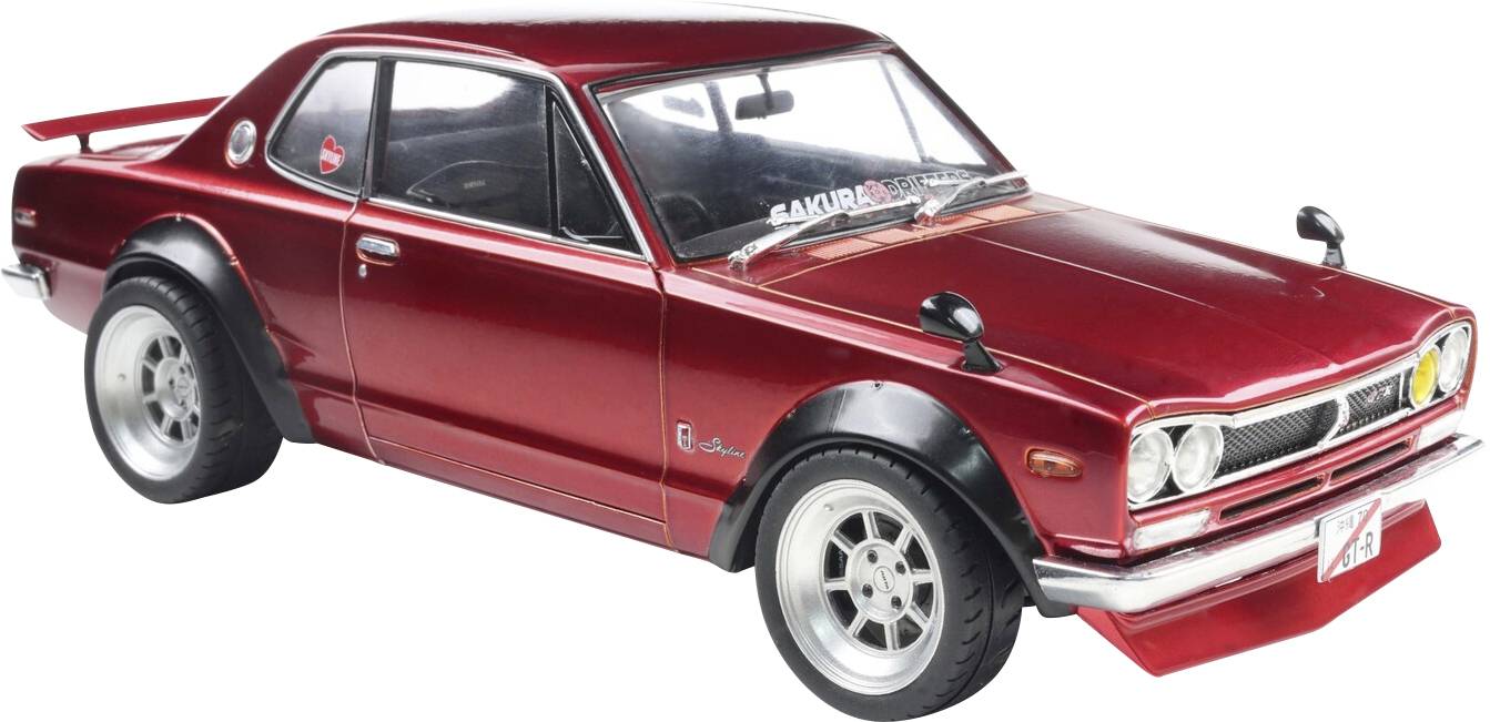 Červený vintage sportovní vůz s širokými koly a elegantní designem karoserie, který předvádí svůj klasický retro styl.