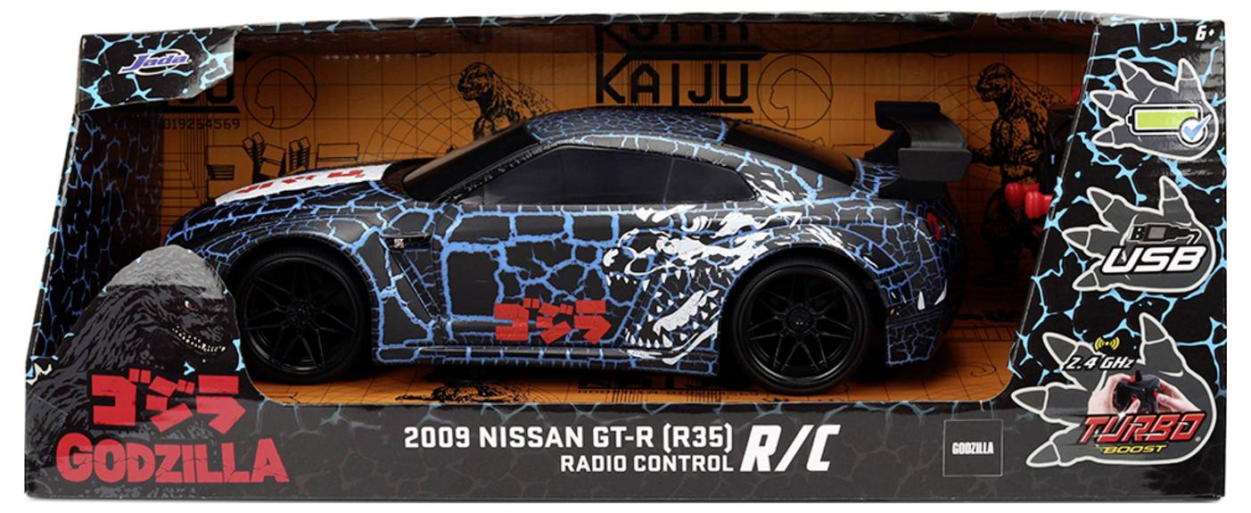 Obal hračky pro dálkově ovládané auto Nissan GT-R z roku 2009, označené jako 'Godzilla'. Obsahuje černý a modrý vzor s efektem praskání.