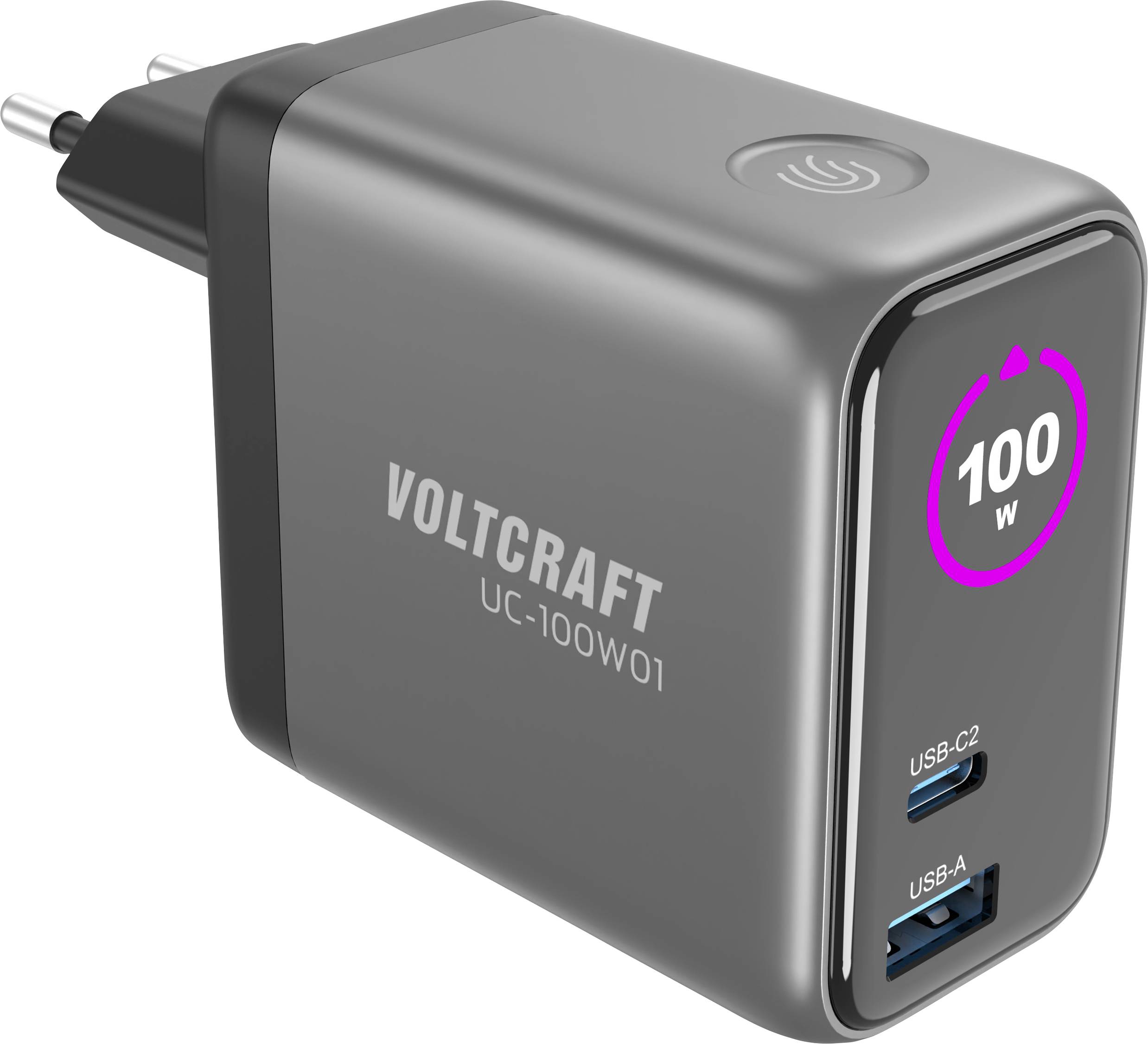Černá síťová nabíječka se dvěma USB porty: USB-C2 a USB-A, na přední straně je zobrazeno '100W'. Je viditelné jméno značky 'VOLTCRAFT'.