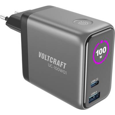 Černá síťová nabíječka se dvěma USB porty: USB-C2 a USB-A, na přední straně je zobrazeno '100W'. Je viditelné jméno značky 'VOLTCRAFT'.