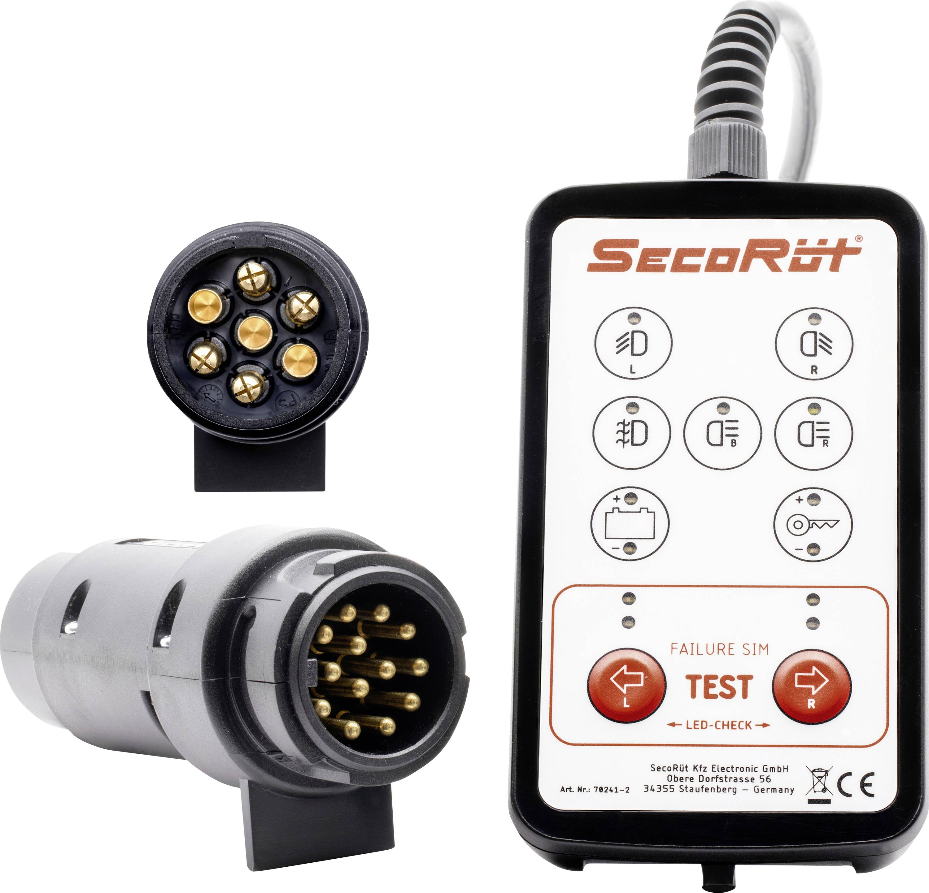 Elektronické zařízení 'SecoRüt' s tlačítkem "TEST" a porty pro připojení určené pro testování automobilních elektrickych systémů. Různé indikační symboly.