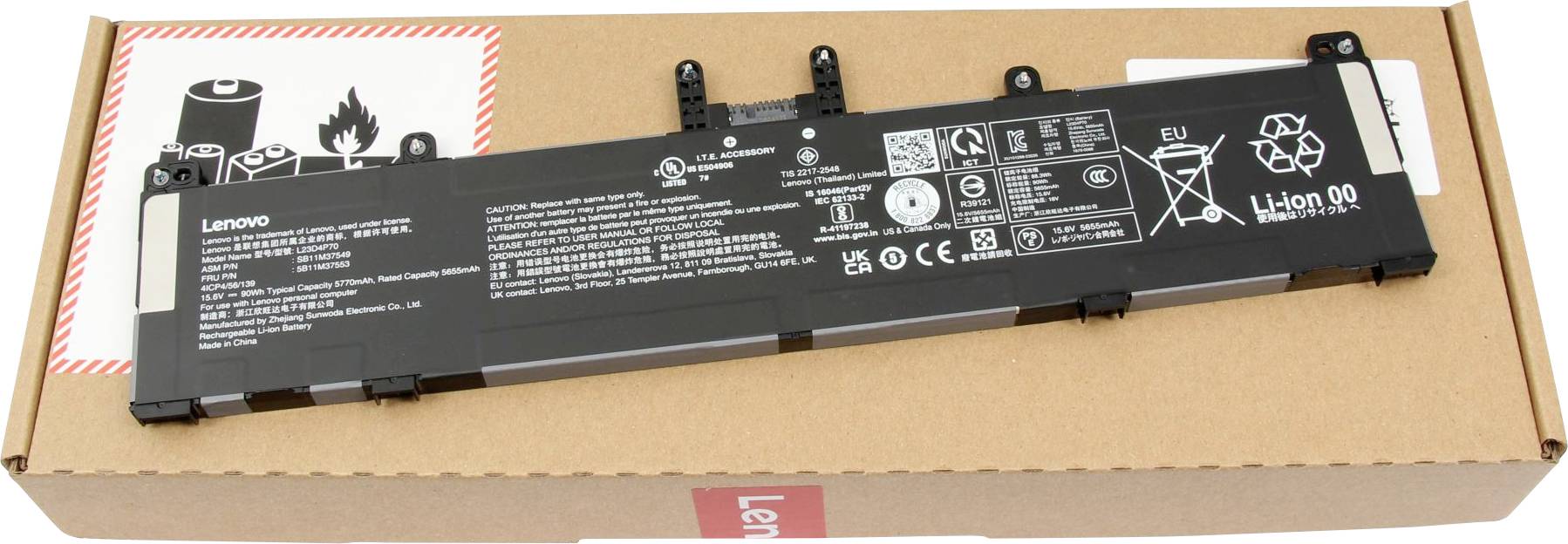 Baterie notebooku Lenovo položená na papírové krabici zobrazující bezpečnostní symboly, údaje výrobce a certifikační loga.