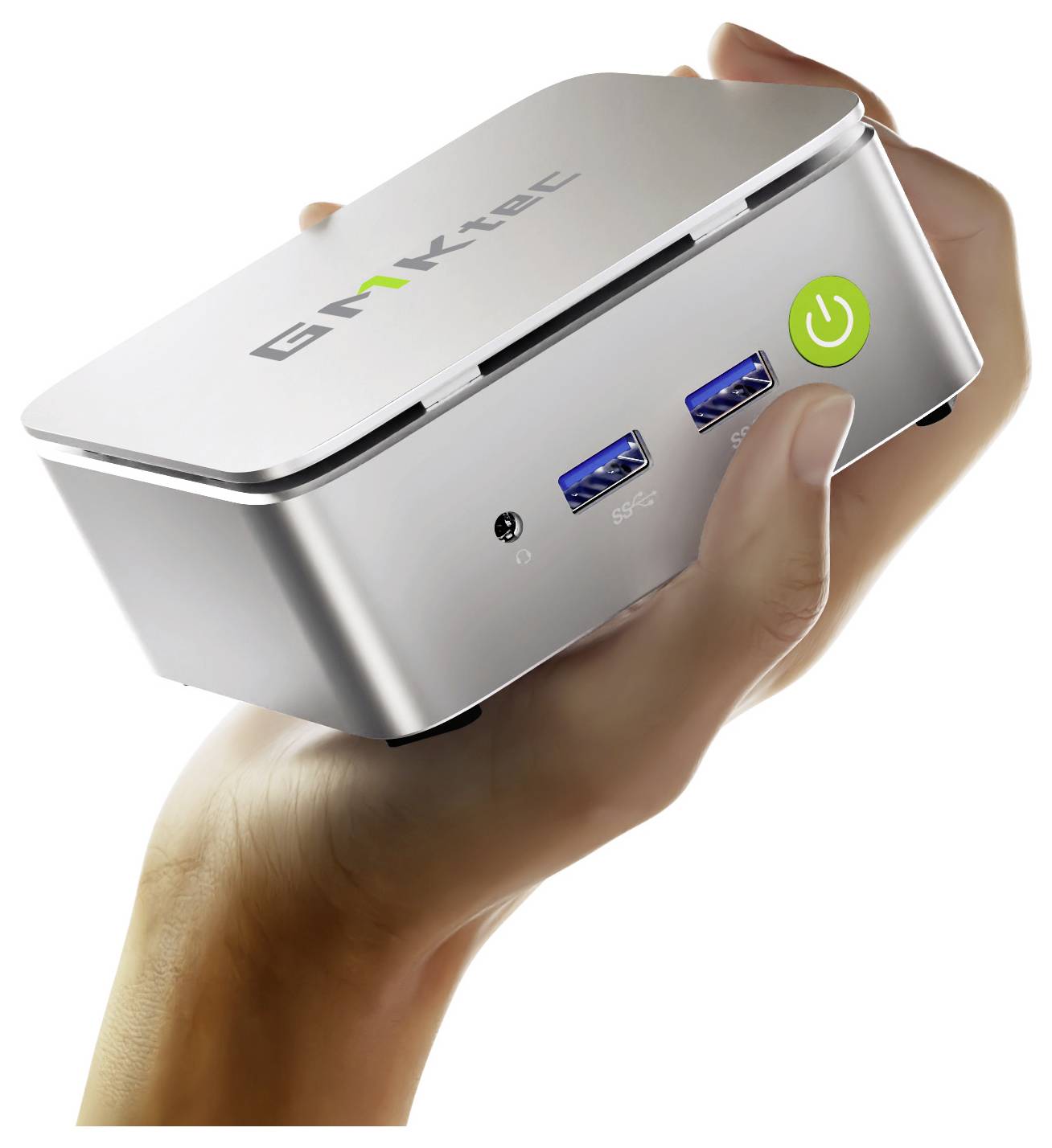 Malé, stříbrné zařízení mini PC s USB porty a tlačítkem napájení je drženo v ruce. Na horní straně je viditelný název značky.