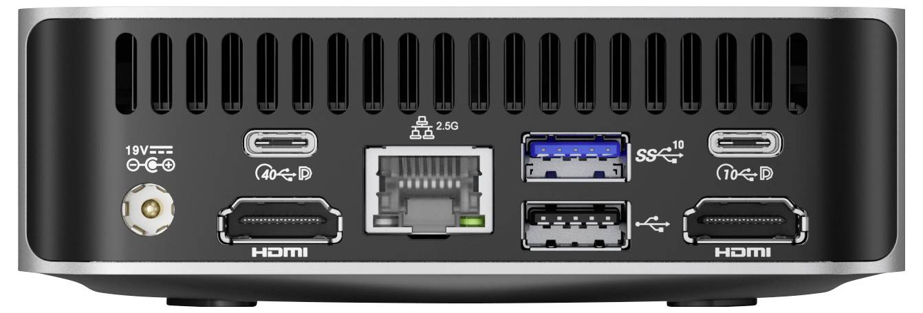 Zadní pohled na počítač s různými porty včetně dvou HDMI, dvou USB, Ethernetu a napájecího vstupu, který ukazuje možnosti připojení.