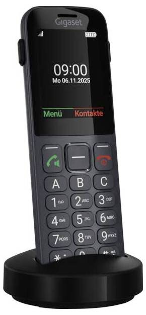 Bezdrátový telefon s velkými tlačítky a displejem zobrazujícím čas '09:00' a datum 'Po 06.11.2025', umístěný na dobíjecí základně.