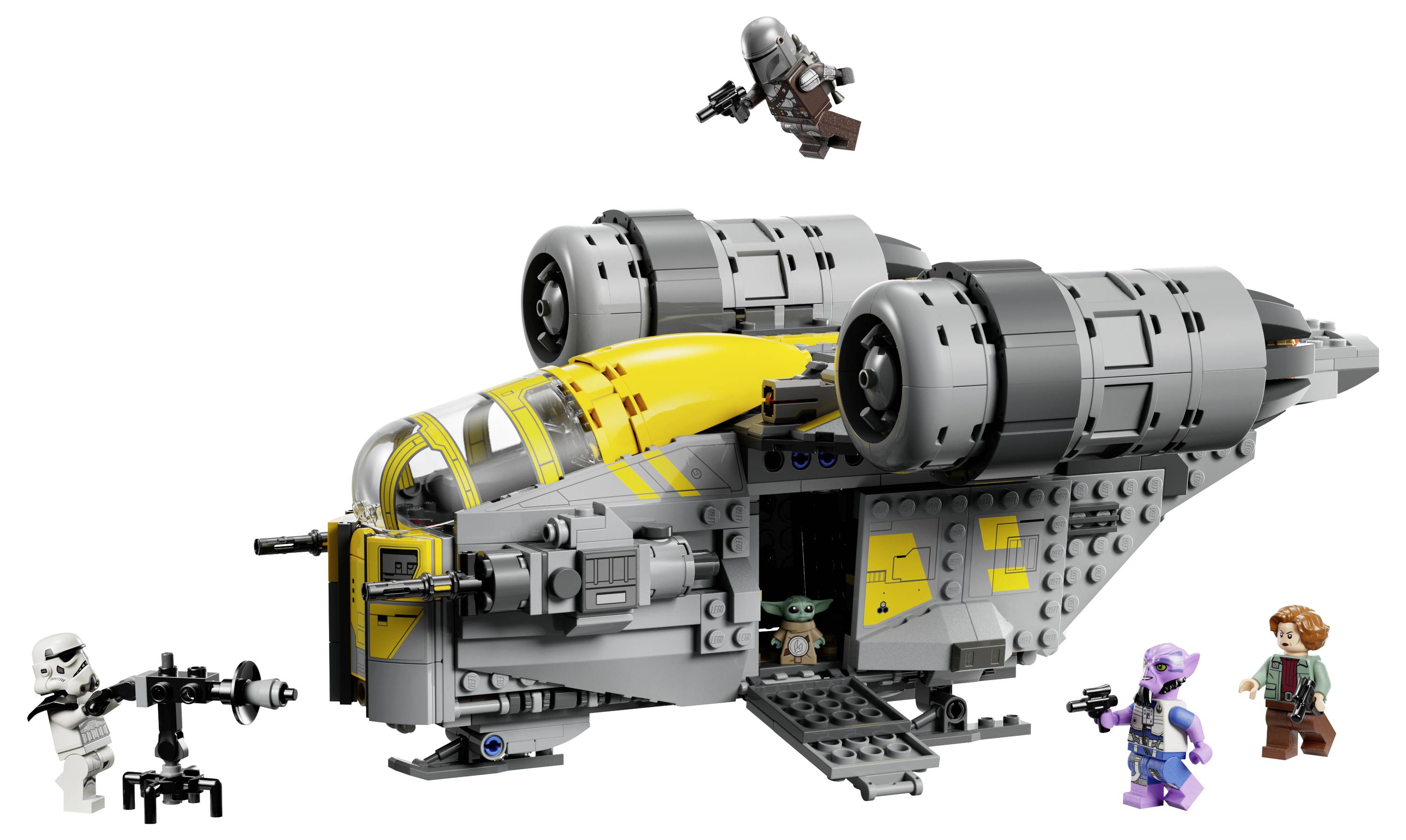 Vesmírná loď LEGO se dvěma velkými motory, opatřena postavičkami ze "Star Wars", včetně malé zelené figurky a dalších v rozmanitých oděvech.