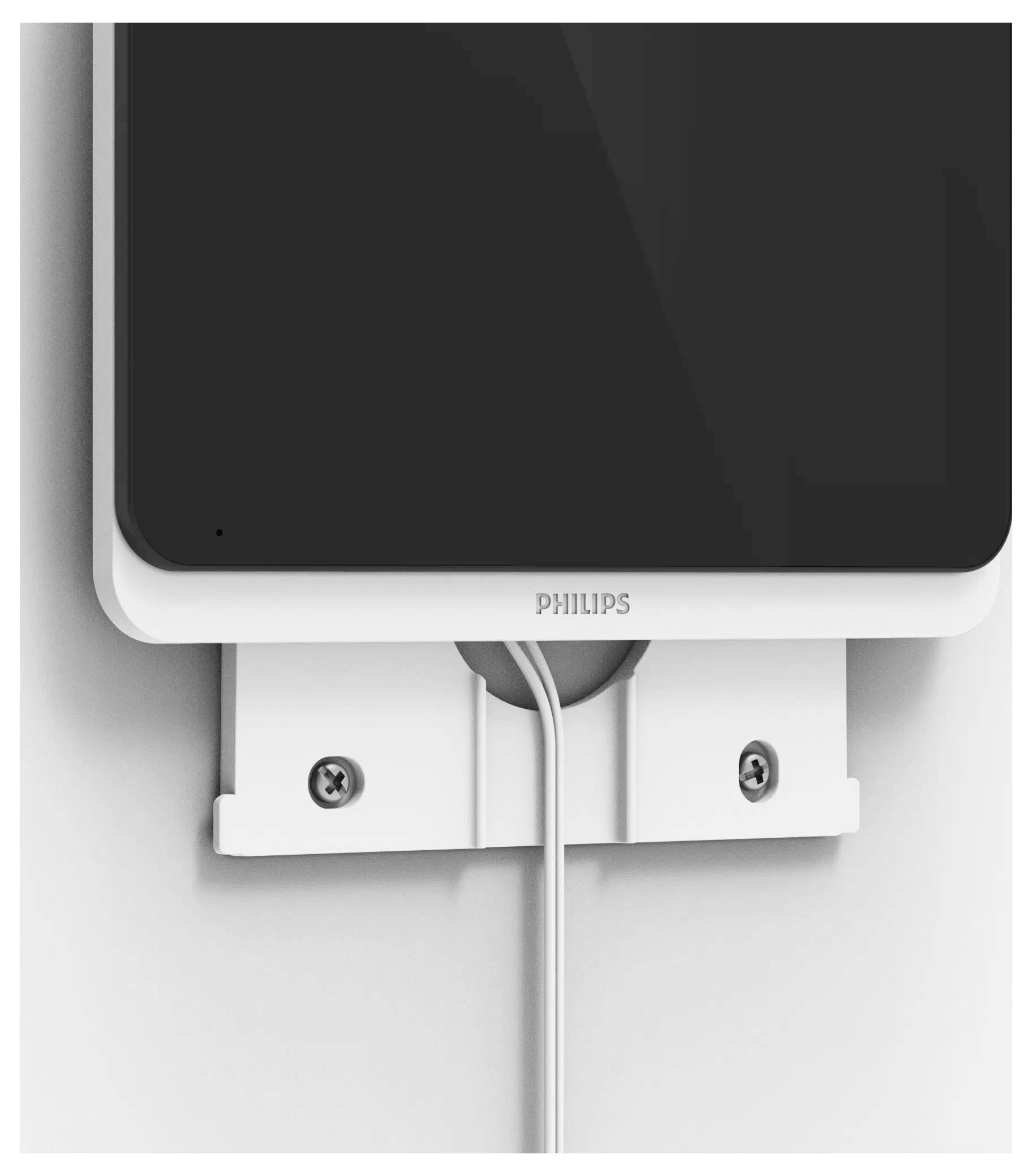 Nástěnný bílý držák s připevňovacími šrouby, který drží zařízení s označením „PHILIPS"; kabel vychází ze spodní části.