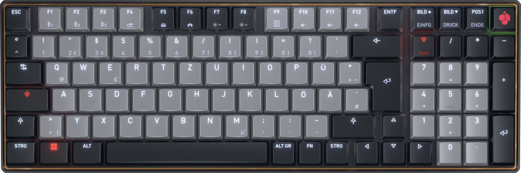 Mechanická klávesnice se šedými a černými klávesami, vybavená numerickou klávesnicí a různými funkcemi klávesy.
