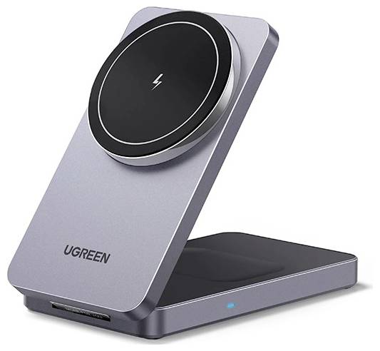 Šedý bezdrátový stojan UGREEN na nabíjení s kruhovou plochou a malou modrou indikační diodou, určený k nabíjení elektronických zařízení.