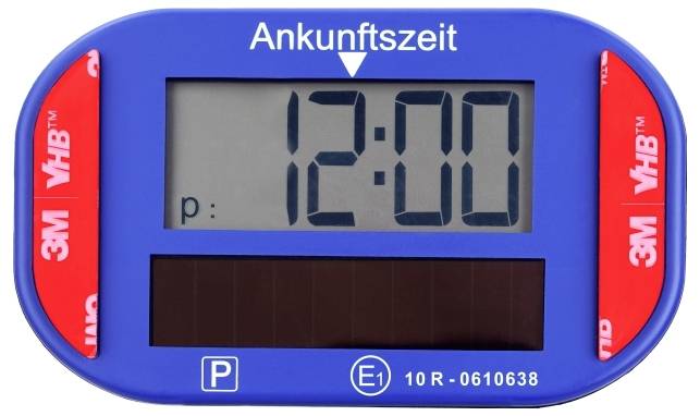 Modrý parkovací časový disc zobrazuje "Ankunftszeit" s digitálním displejem ukazujícím 12:00.