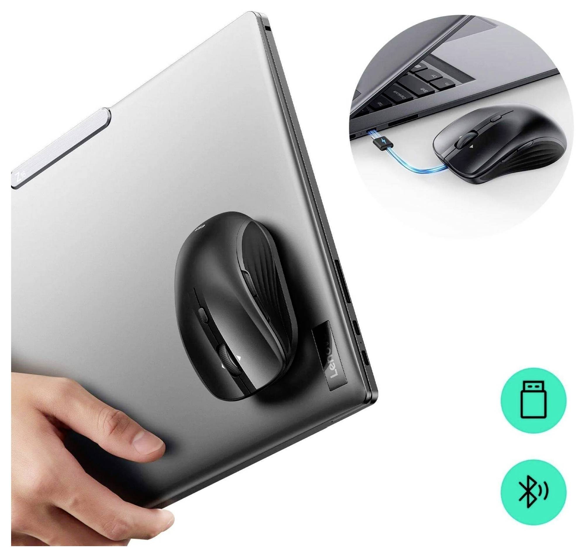 Černá bezdrátová myš magneticky připevněná ke stříbrnému notebooku a zobrazená připojená přes USB. Jsou zobrazeny ikony Bluetooth a USB.