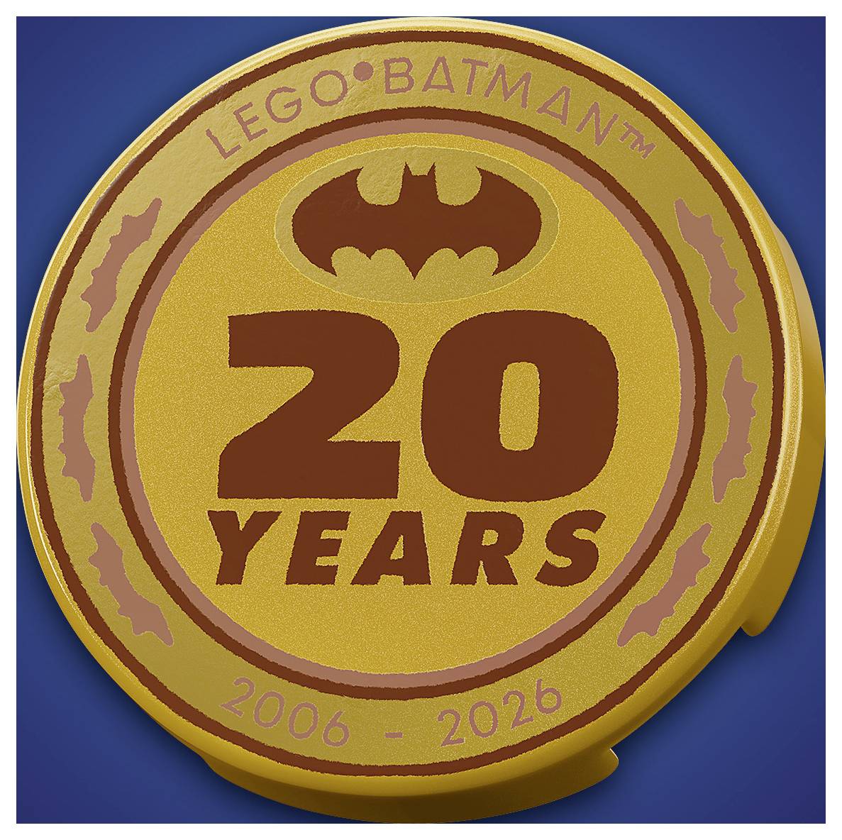 Logo "LEGO Batman 20 let" s symbolem netopýra, textem "2006 - 2026" a barevným schématem v žluté a hnědé barvě.