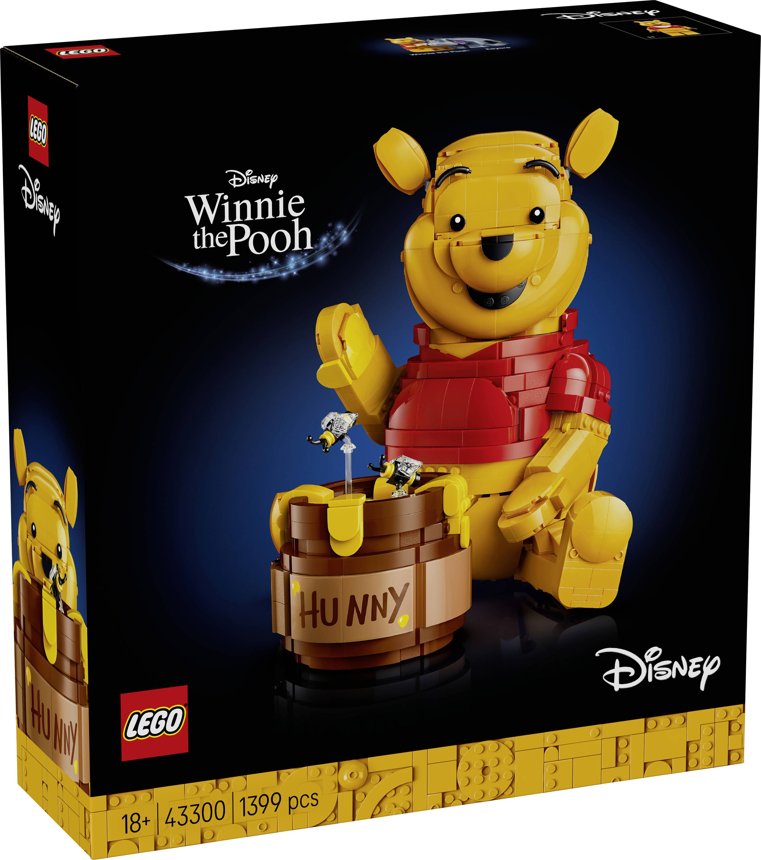 Krabice sady "Lego Medvídek Pů" zobrazující velký model postavený z cihel Medvídka Pů držícího malý hrnec označený "Medovina".