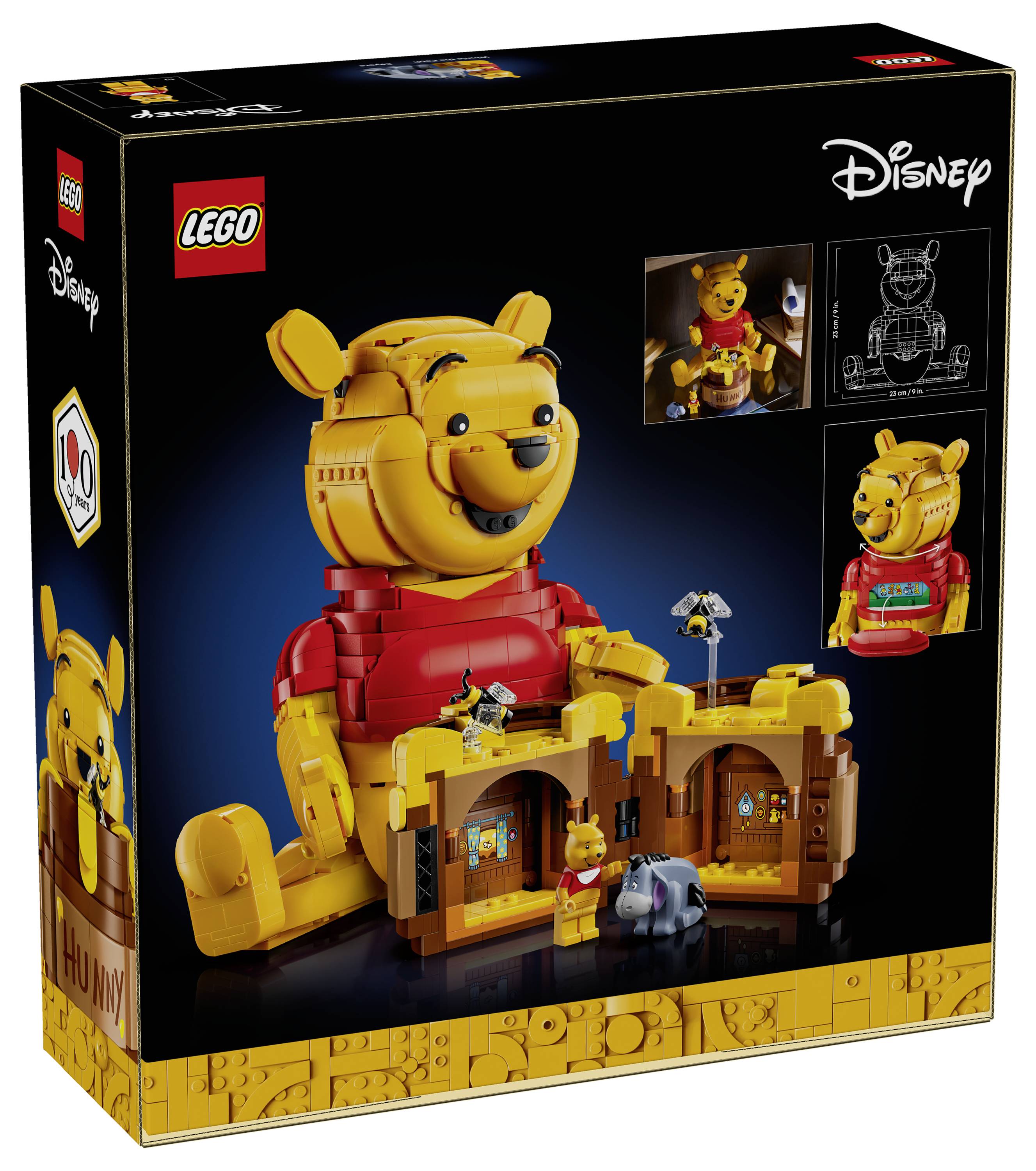 Sada LEGO zobrazující velký model medvěda s menšími figurkami a stavební scénou na připomenutí 100. výročí společnosti Disney.