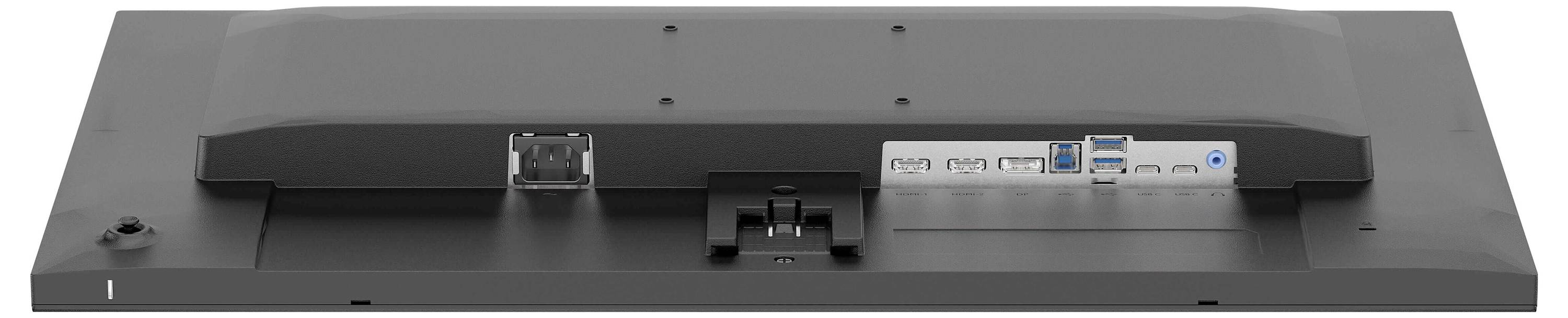 Obrázek zobrazuje zadní panel počítačového monitoru s různými porty pro připojení, včetně HDMI, DisplayPort, USB a přívodu napájení.