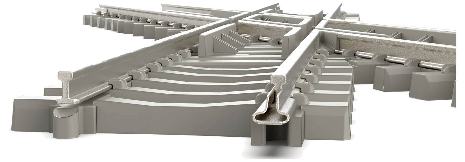 Detailní pohled na složitou železniční křižovatku s více kolejemi sbíhajícími se a rozbíhajícími, zdůrazňující složitý design.