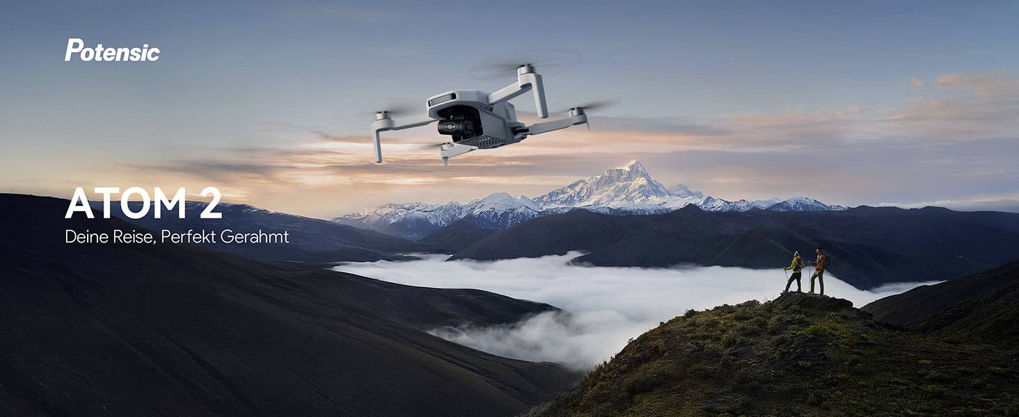 Dron se čtyřmi vrtulemi v letu, doplněný dálkovým ovladačem zobrazujícím horskou krajinu, bateriový blok a přepravní kufr.