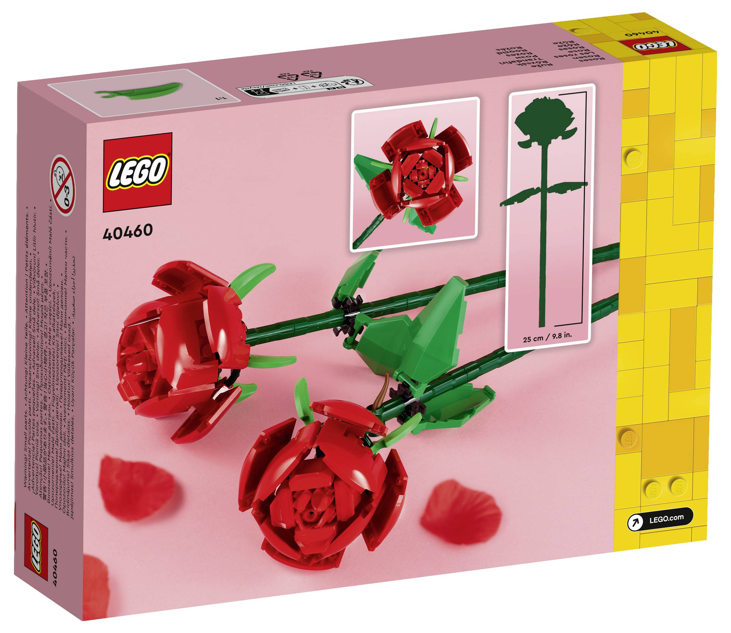 Krabice sady LEGO 40460 obsahující červené růže vyrobené z kostek LEGO, zobrazené na růžovém pozadí se rozptýlenými okvětními lístky.
