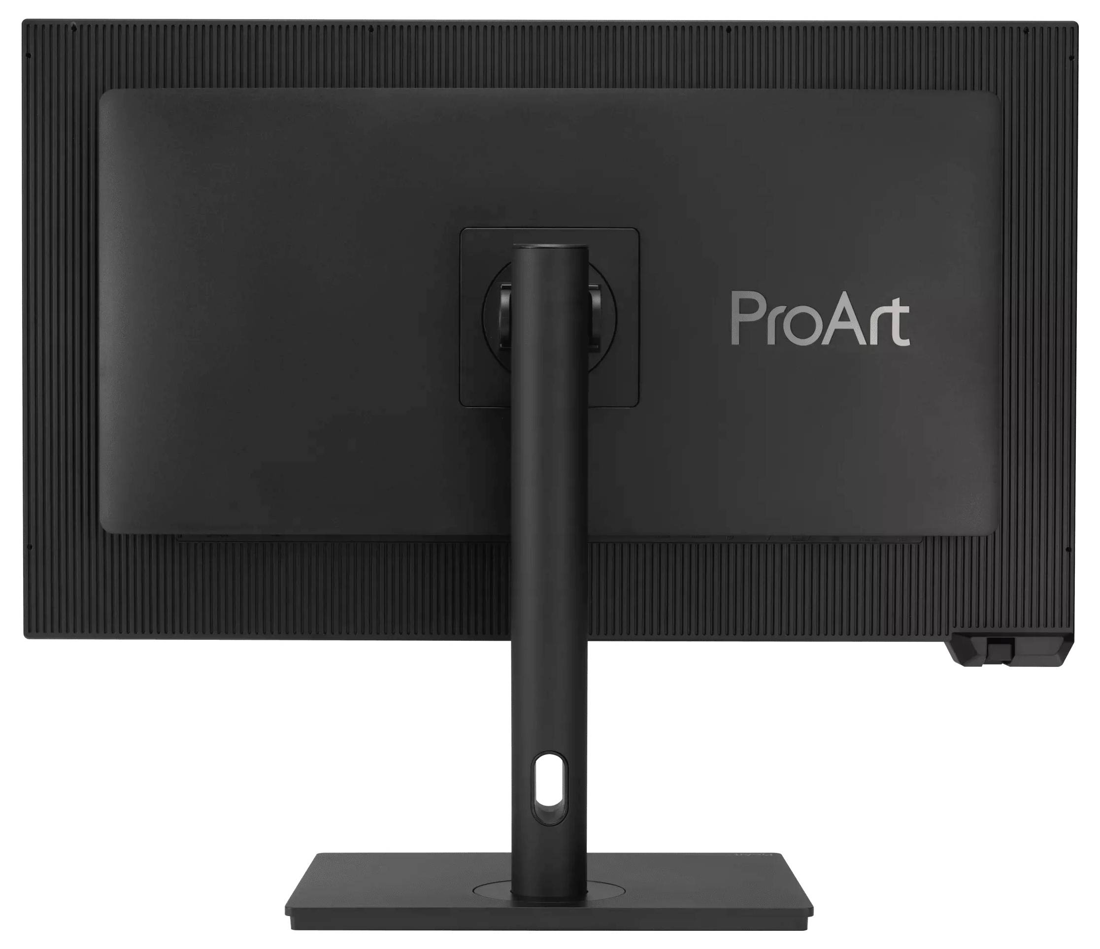 Na obrázku je vidět zadní strana černého počítačového monitoru značky ProArt s obdélníkovým stojanem a texturovaným rámem.