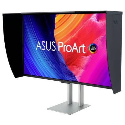 Monitor ASUS ProArt OLED s kapotou pro kalibraci barev, zobrazující vibrantní abstraktní barvy.