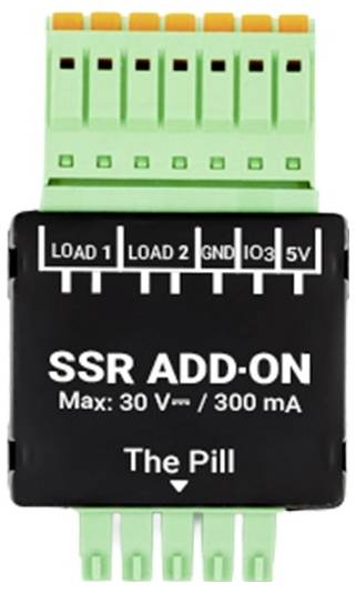 Modul „SSR ADD-ON" označený jako „The Pill", s vstupy pro „LOAD 1", „LOAD 2", „GND", „IO3", „5V". Maximum: 30 V/300 mA.