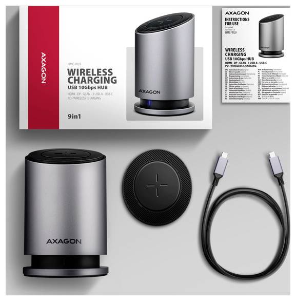 Bezdrátový nabíjecí USB hub ve stříbrné barvě s balením, nabíjecím podložkem a kabelem USB-C. Označen "AXAGON 9in1, 10Gbps, 160W".